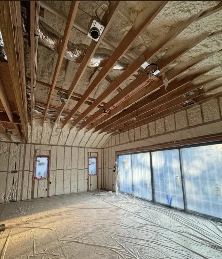 Interior walls and ceiling insulated with spray foam during new construction in Yarmouth